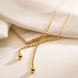 Elegant gold stainless steel beaded long necklace with two polished spherical pendants
