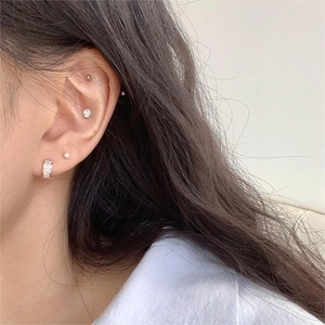 925 sterling silver ear cuff set with cubic zirconia and pearls on a female model