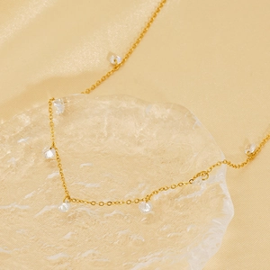 Elegant 18k gold plated titanium steel necklace featuring clear teardrop zircon pendants
