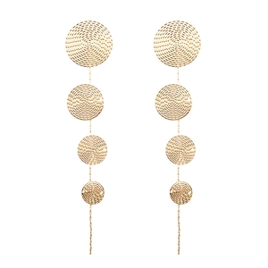 Golden geometric graduated circle tassel earrings with spiral texture on white background