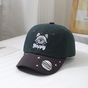 Detailed close-up of cartoon bulldog embroidery on green canvas kids baseball cap