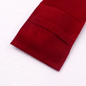 Detailed view of the soft red velvet jewelry pouch with neat stitching and premium texture