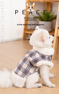 Detail of warm plaid dog vest with white faux fur lining and golden metal D-ring for leash