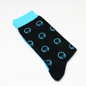 Detail of crew socks with blue headphone patterns and ribbed cuffs on black cotton fabric