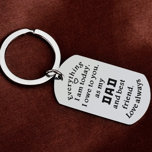 Silver stainless steel engraved keychain for dad with heartfelt quote on red silk background