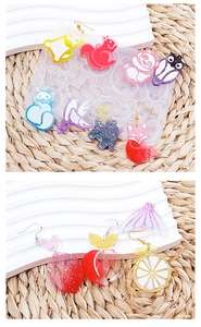 Detailed silicone mold with cute animal and fruit resin earrings featuring glitter finish