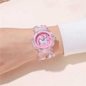 Pink cartoon unicorn LED watch with soft silicone strap shown on a child's wrist