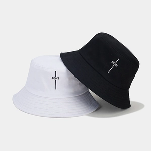 Minimalist embroidered Peace bucket hats in black and white high-quality cotton fabric