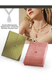 Rectangle portable jewelry boxes in sage green and blush pink with snap closures