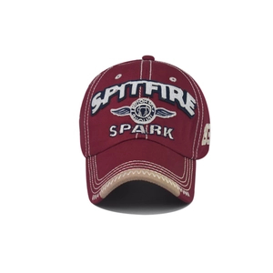 Detail of burgundy cotton baseball cap with SPARK embroidery and distressed vintage brim