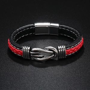Close-up of black and red braided leather bracelet with silver magnetic metal clasp