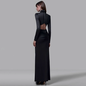 Detail shot of the backless high collar design on a black bodycon midi dress