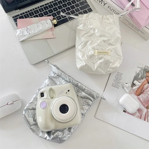 Glossy PU leather drawstring pouch for camera storage with elegant bow embroidery