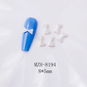 Détails de bijoux d'ongles nœuds argentés avec perles, taille 8x5mm modèle MZH-8194