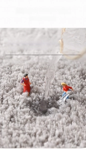 Close-up of thick plush gray bathroom mat showing high density water absorbent fibers