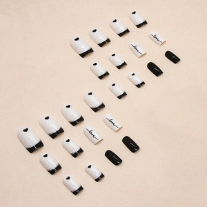 French black and white press-on nails with love and heart patterns in a medium square shape