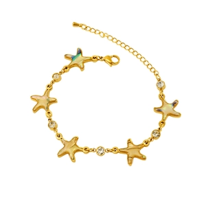 Gold starfish bracelet with zircon and iridescent inlay, minimalist jewelry for women