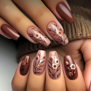 Long coffin press-on nails with autumn floral art and solid brown earth tones