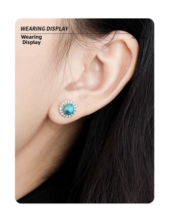 Macro side view of S925 sterling silver turquoise stud earrings with zircon halo