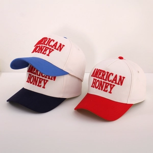 Detailed embroidery of American Honey text on multi-color adjustable baseball caps