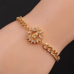 Detail of adjustable gold-plated bracelet featuring a zircon-inlaid Virgin Mary charm