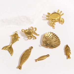 Detailed gold marine pendants featuring crab, octopus, and shell shapes for jewelry making
