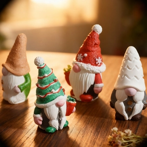 Set of four festive Christmas gnome resin figurines for home holiday desktop decoration