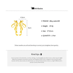 Detailed size chart for yellow bow earrings showing 9cm length and alloy material