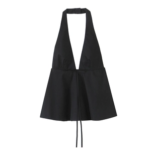 Detail of a black halter neck top featuring a deep V-neck and flared ruffled hemline