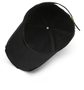Detail view of distressed baseball cap brim with internal stitching and metal buckle