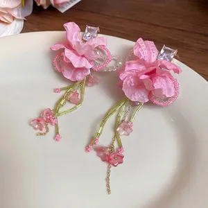 Pink fabric flower tassel earrings with sparkling rhinestones and delicate gold chains