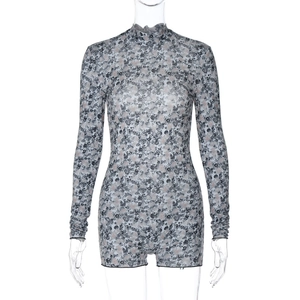 Close-up of floral print sheer mesh long sleeve jumpsuit with backless lace-up detail