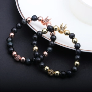 Detailed macro of copper crown beaded bracelets with colorful tiger eye stones and zircons
