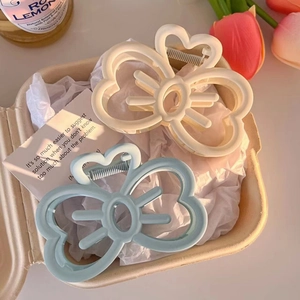 Elegant bow and flower hair clips in cream white and light blue matte resin finish