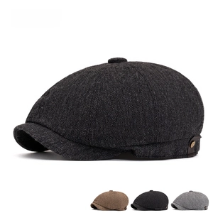 Classic British herringbone newsboy cap in grey and brown tweed with side leather strap