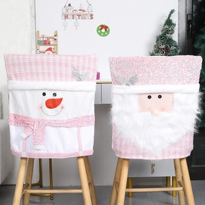 Pink plaid Christmas chair covers with plush Santa and Snowman holiday decorations