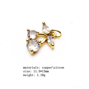 Detailed view of 11.5x13mm gold bee charm accessory with zircon inlay for jewelry