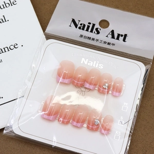 Handmade cherry blossom pink gradient French press-on nails with sparkling rhinestones