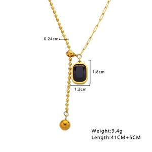 Detail of gold necklace showing square black zircon pendant and mixed chain dimensions