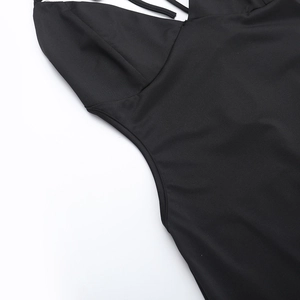 Detailed close-up of neck stitching and backless cut on a black sexy jumpsuit