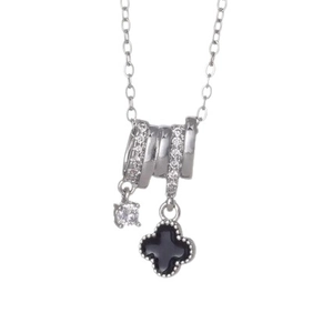 Polished silver clover necklace with black onyx pendant and sparkling zircon stones