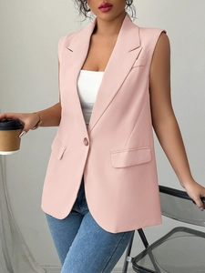 Detail of pink sleeveless vest blazer with notch lapel and single button closure