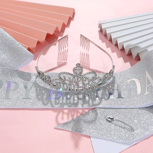 Silver crystal crown tiara and glitter Happy Birthday sash on pink party background