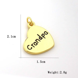 Detailed view of a gold heart pendant with Grandpa engraving and specific dimensions