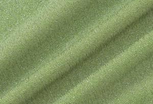 Macro shot of green metallic knit fabric with shimmering silver threads and texture