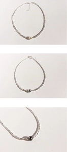 Detail of silver irregular beads and pearls on choker necklaces with lobster clasp
