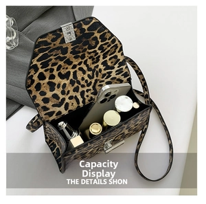 Detailed view of leopard print crossbody bag interior capacity with metal lock buckle