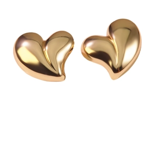 Minimalist gold heart stud earrings in polished titanium steel for women, 45-degree angle view