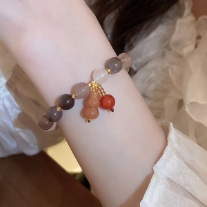 Minimalist beaded puppy bracelet with colored translucent beads and gourd charm pendant
