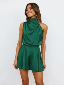 Detail of elegant dark green satin halter romper with draped neckline and pleated waist